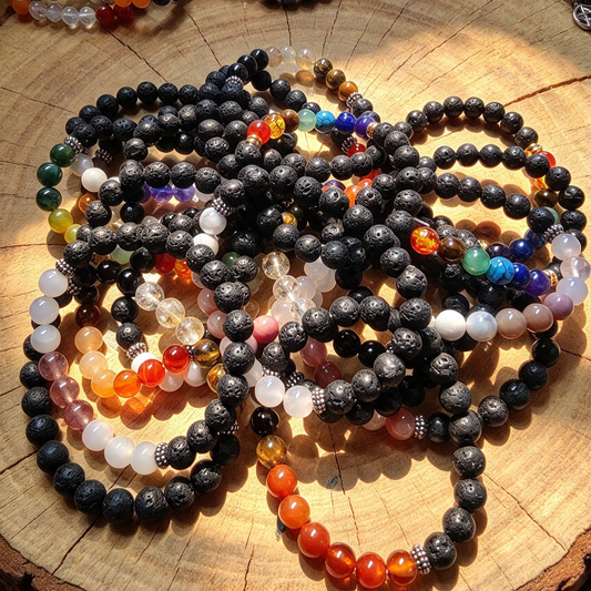 LAVA STONE AND CRYSTAL BRACELET. PUT YOUR FAVORITE SCENT OR OILS ON THE LAVA STONE SMELL BEAUTIFUL ALL DAY LONG. Random colour sent .Or WhatsApp me your chosen colour.