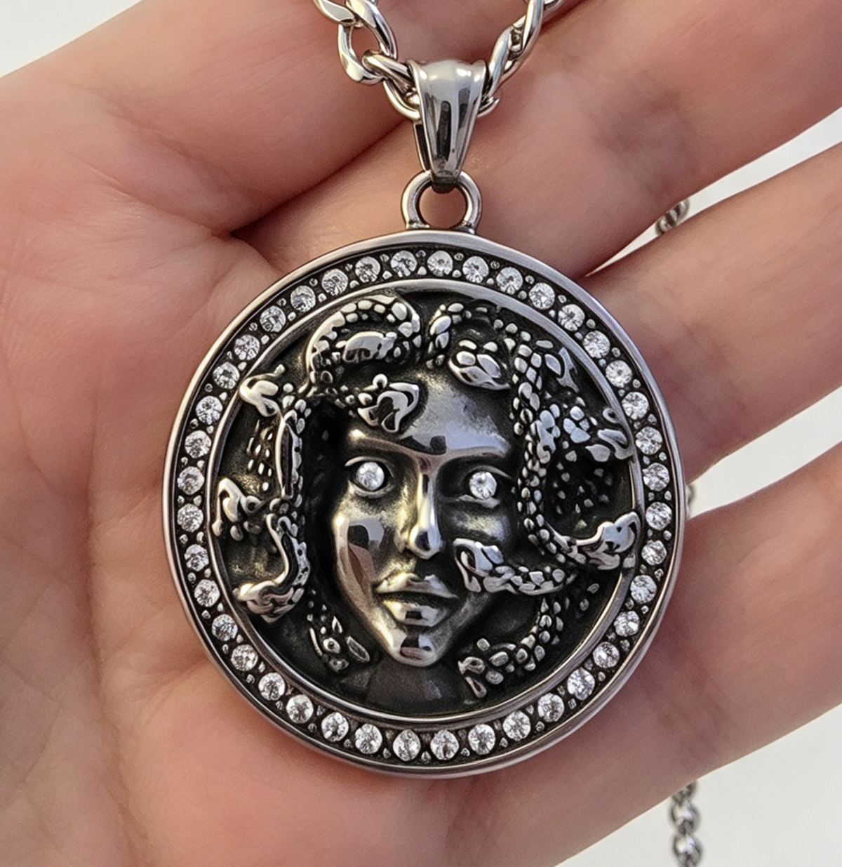 STAINLESS STEEL MEDUSA PENDANT FREE STAINLESS STEEL CHAIN.