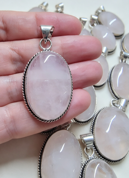 NATURAL ROSE QUARTZ PENDANT Silver plated. Supplied with a free stainless steel chain . Random Pendant sent .