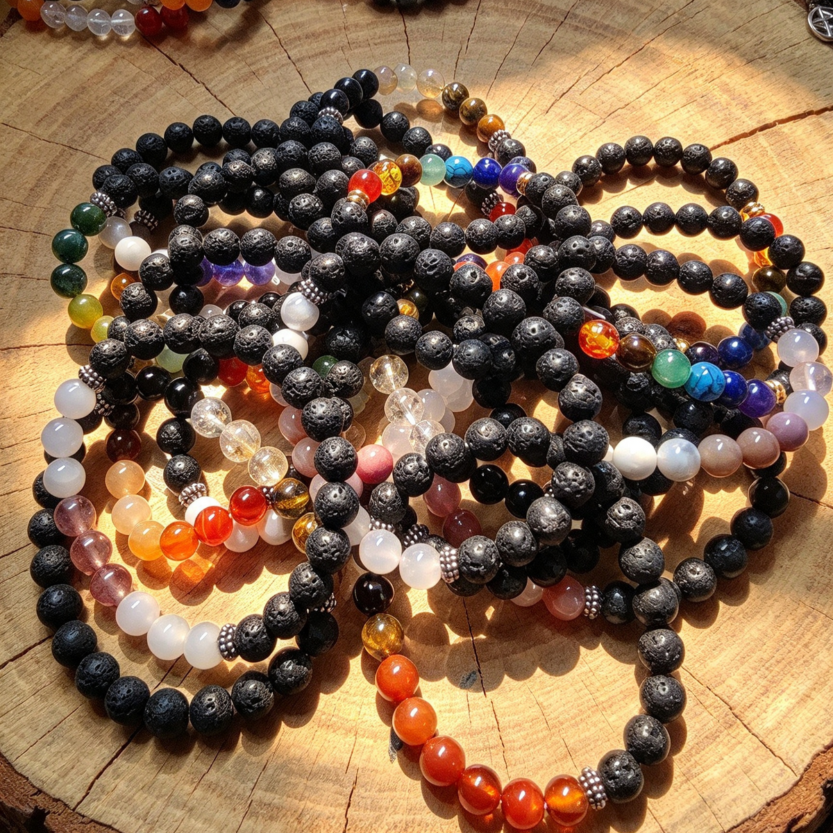 LAVA STONE AND CRYSTAL BRACELET. PUT YOUR FAVORITE SCENT OR OILS ON THE LAVA STONE SMELL BEAUTIFUL ALL DAY LONG. Random colour sent .Or WhatsApp me your chosen colour.