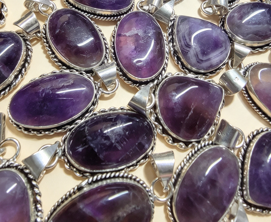 NATURAL AMETHYST PENDANT Silver plated. Comes with a free stainless steel chain. Random Pendant sent.