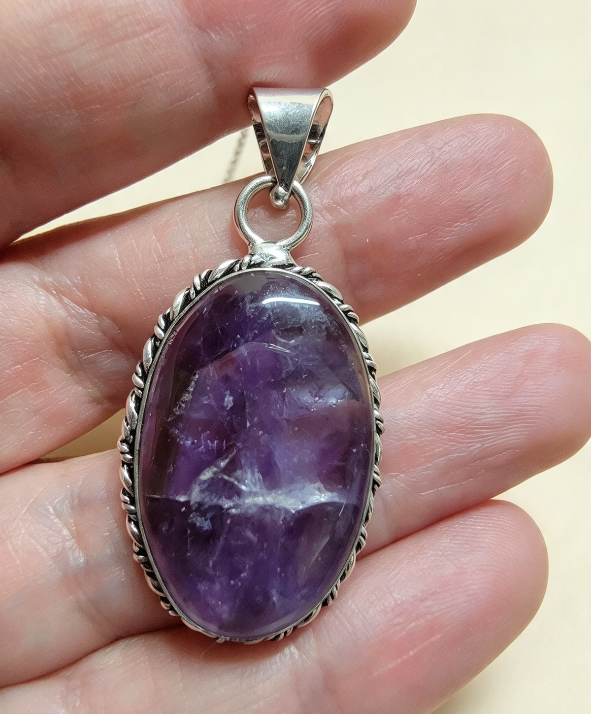 NATURAL AMETHYST PENDANT Silver plated. Comes with a free stainless steel chain. Random Pendant sent.