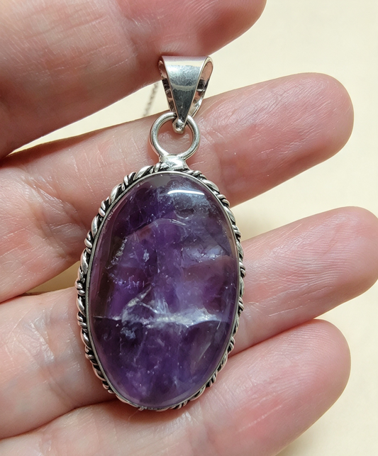 NATURAL AMETHYST PENDANT Silver plated. Comes with a free stainless steel chain. Random Pendant sent.